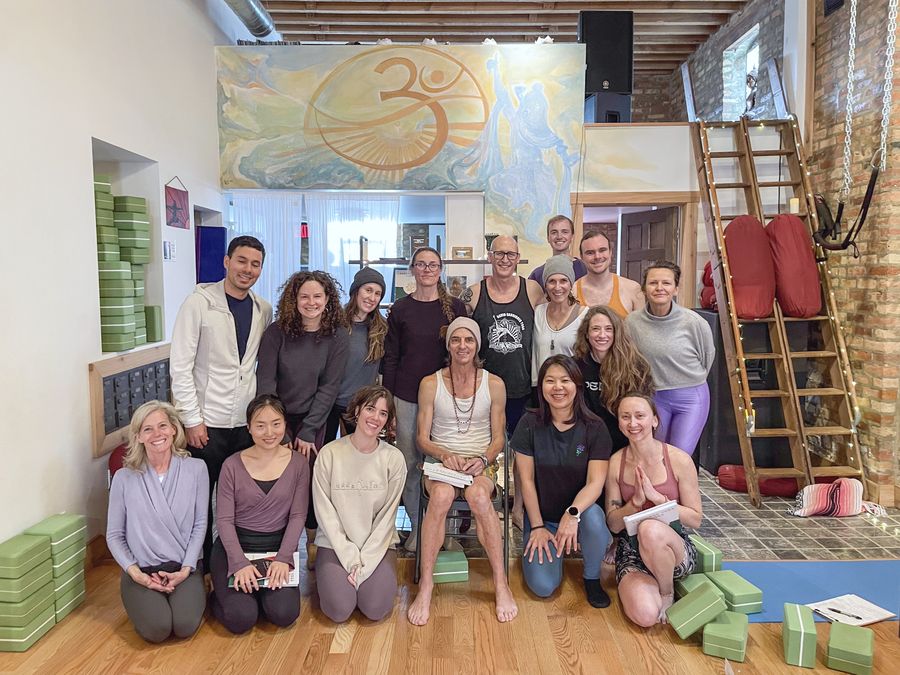 A big group gathered for a photo inside the studio