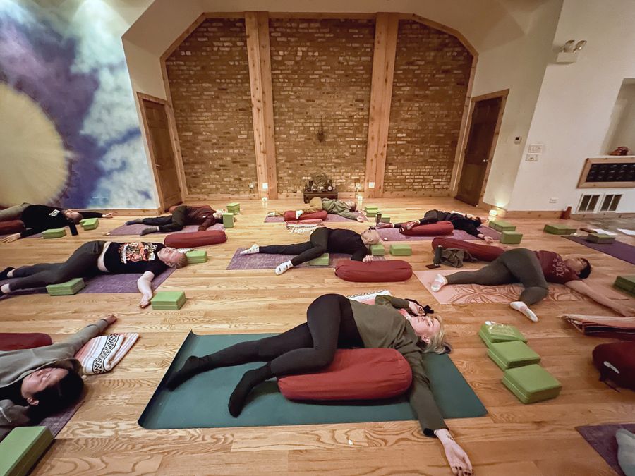 The studio set up for an evening class, lit by candles and salt lamps